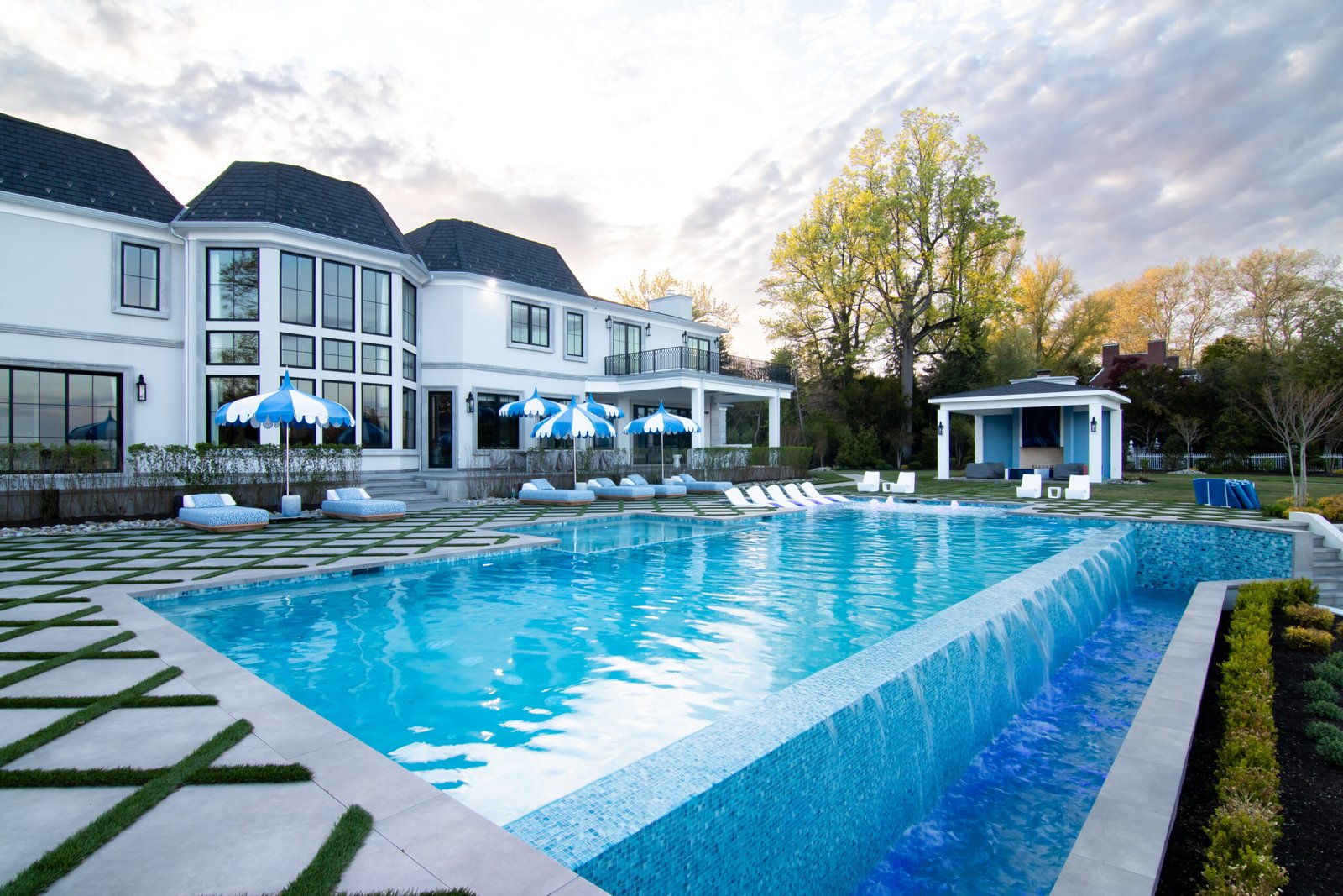 Luxury custom swimming pool in Red Bank, New Jersey featuring modern backyard design, premium pool construction, elegant outdoor living space, high-end landscaping, and resort-style pool installation for homeowners in NJ.